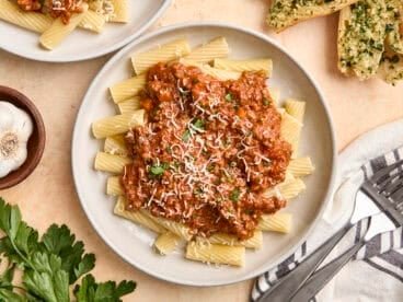 Overhead view of a plate of bolognese sauce and pasta.