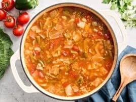 Overhead view of a pot of cabbage soup.