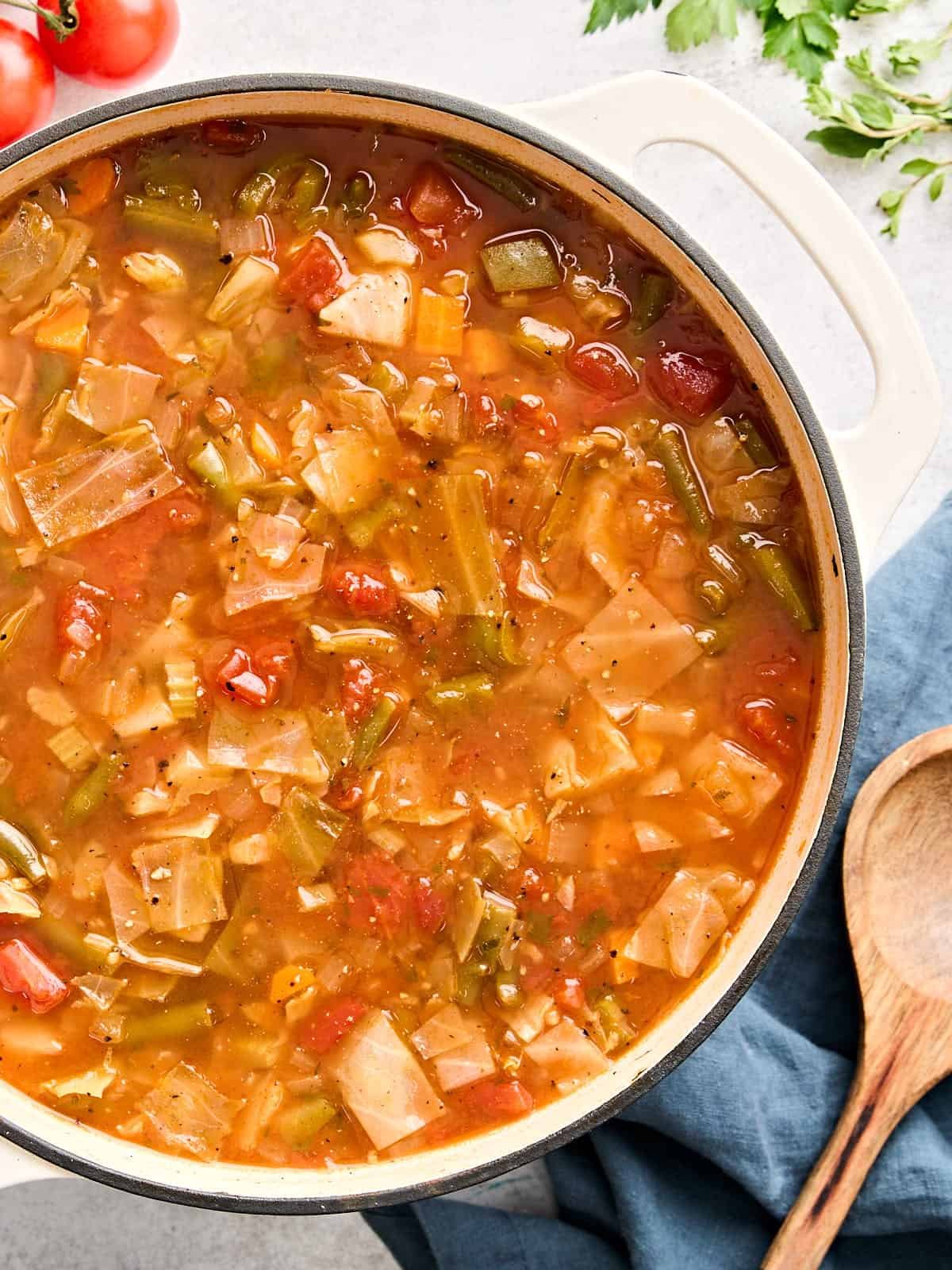 Overhead view of a pot of cabbage soup.