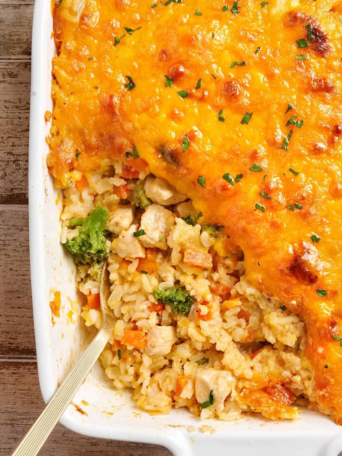 Overhead view of chicken and rice casserole with a spoon.