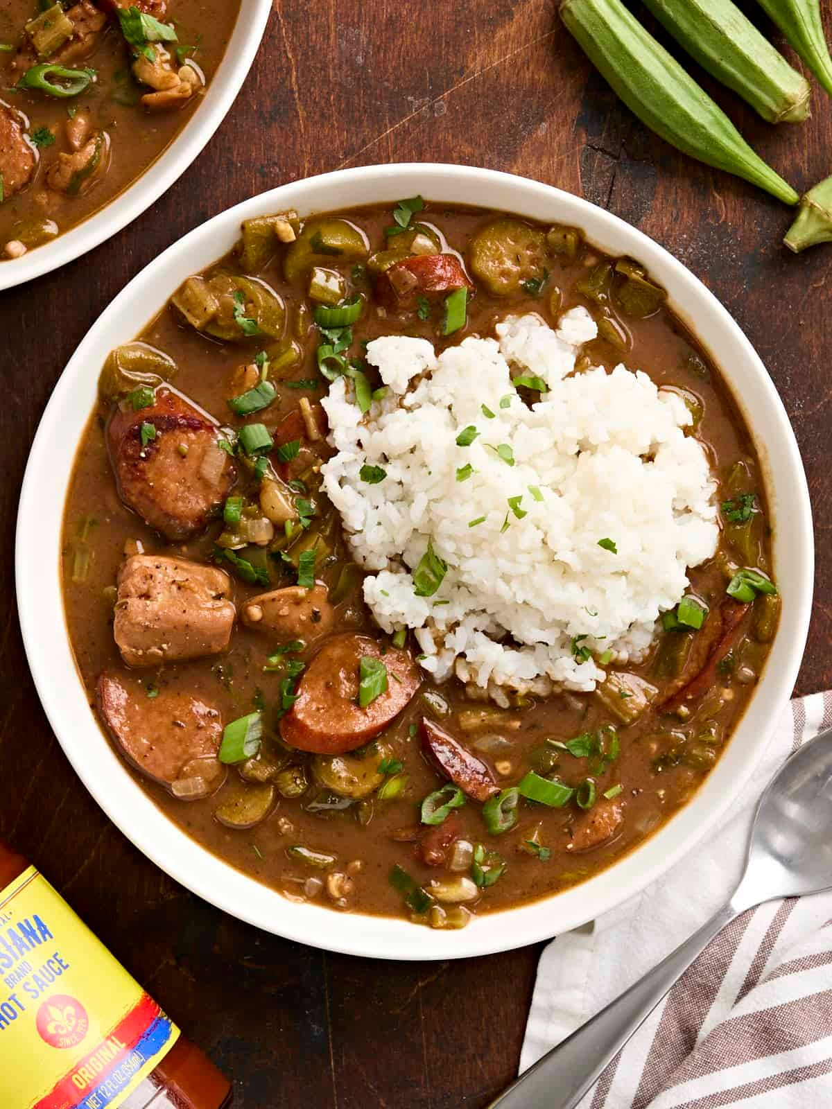 Overhead view of a bowl of gumbo and rice.