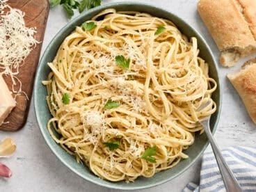 Overhead view of a plate of fettuccine alfredo with a fork.