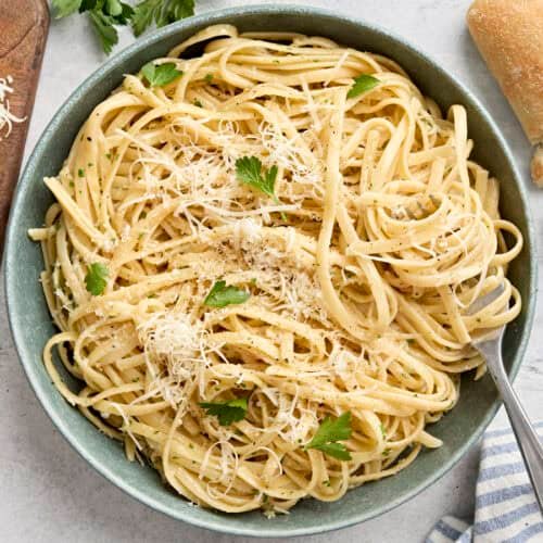 Overhead view of a plate of fettuccine alfredo with a fork.