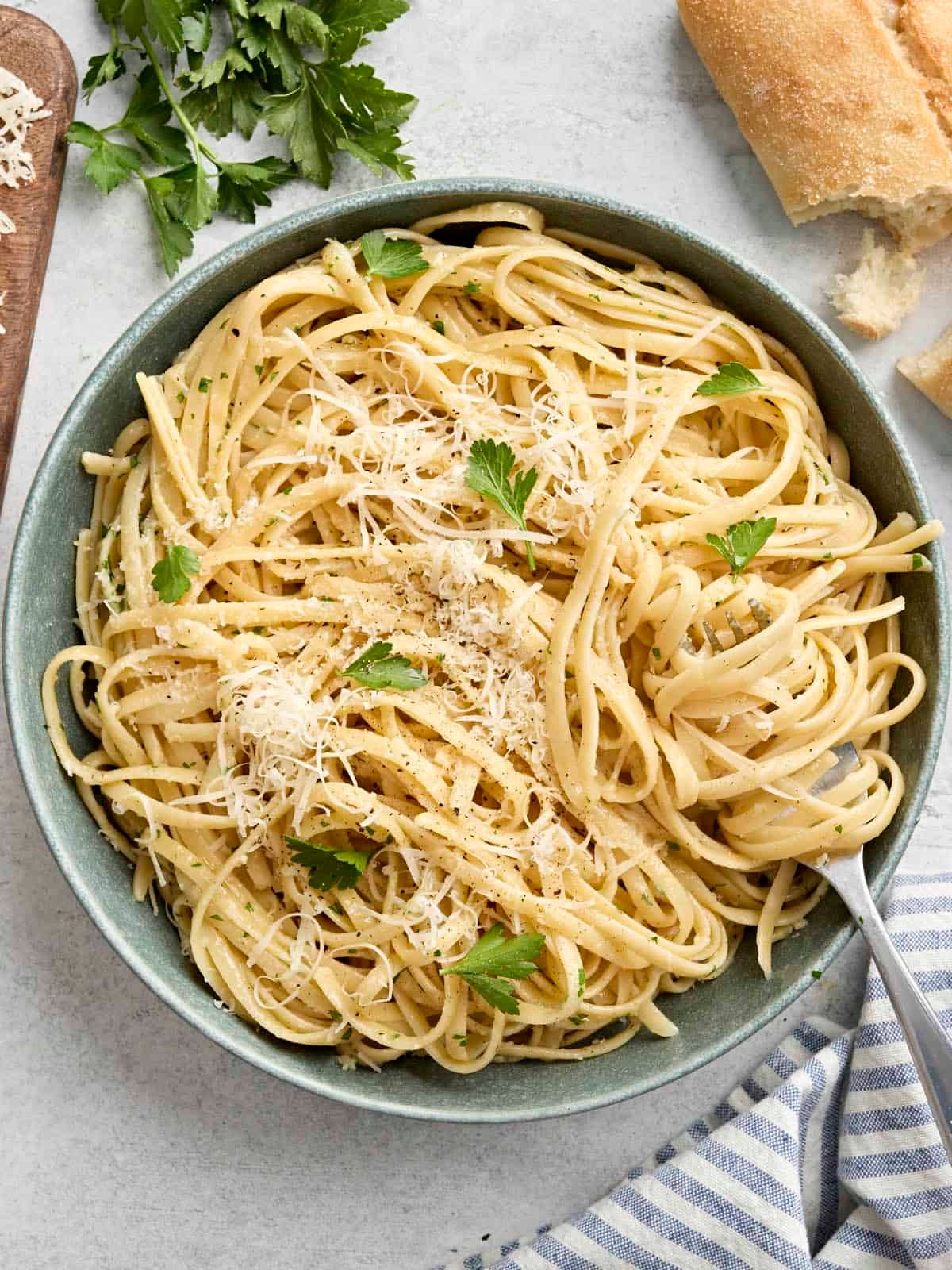 Overhead view of a plate of fettuccine alfredo with a fork.