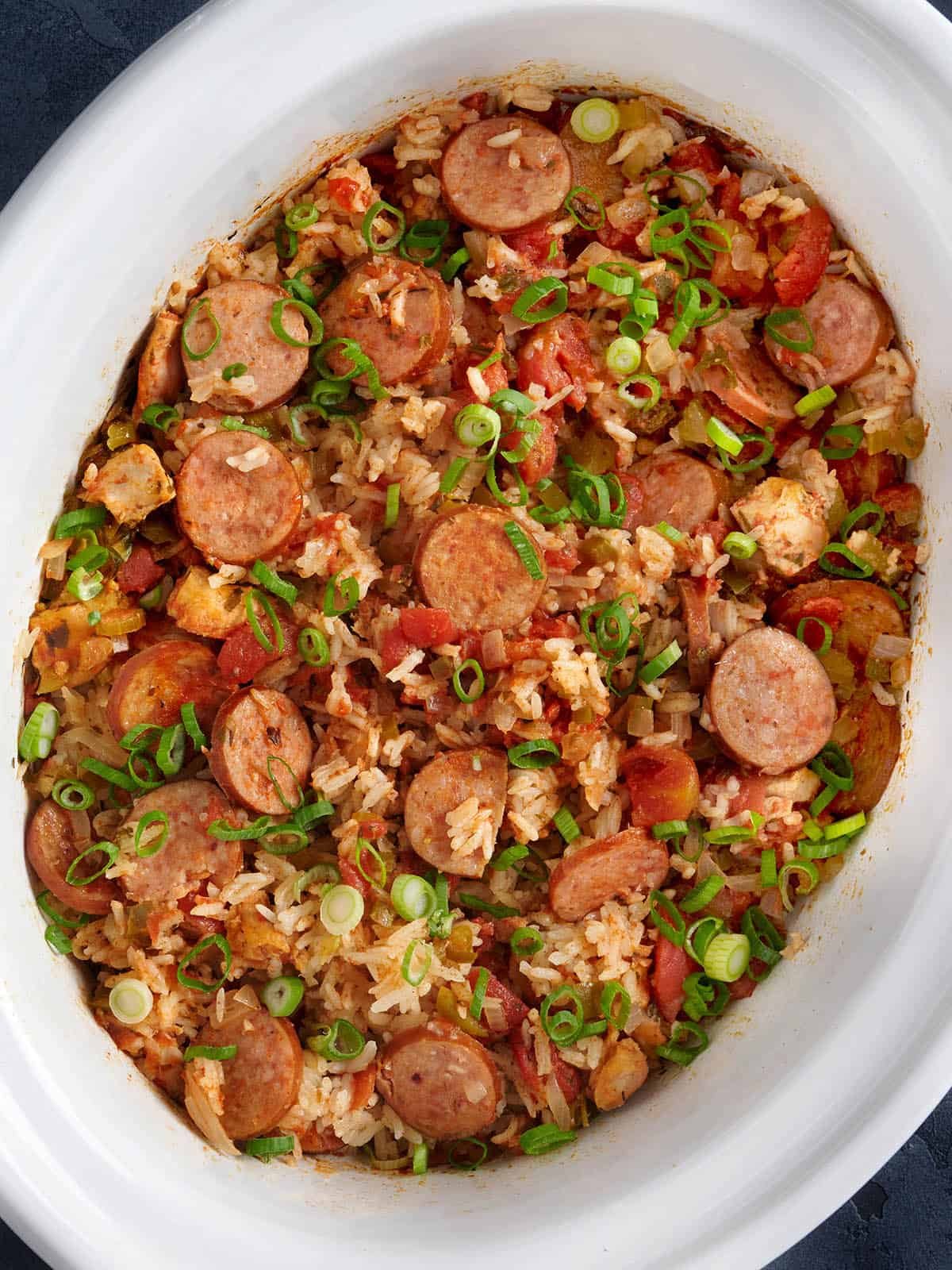 Jambalaya in a white crockpot. 