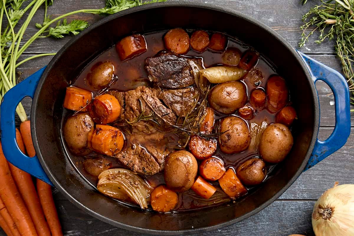 Overhead view of a pot roast in a dutch oven.