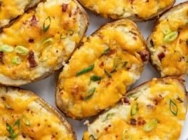 Close up overhead view of twice baked potatoes staked beside each other.