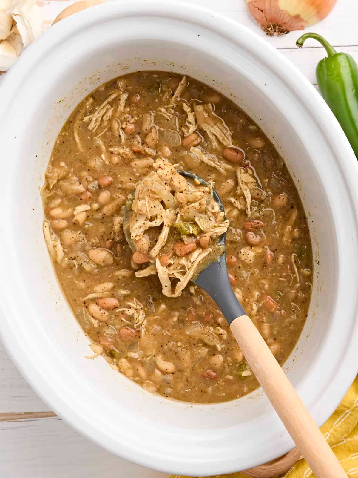 Overhead view of slow cooker white chicken chili in a crockpot.